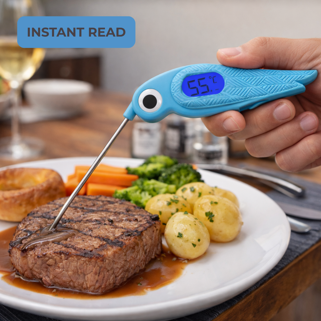 Digital food thermometer checking the temperature of cooked steak