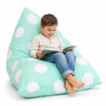 kids bean bag cover in mint green used as a reading chair