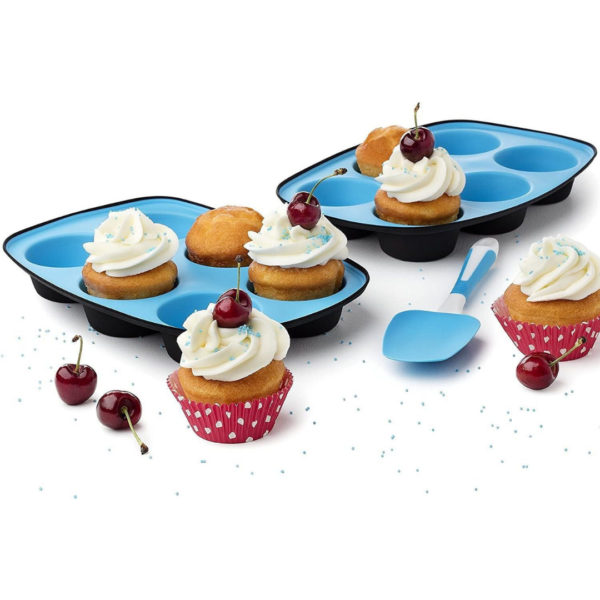 Silicone muffin trays filled with cupcakes on white background